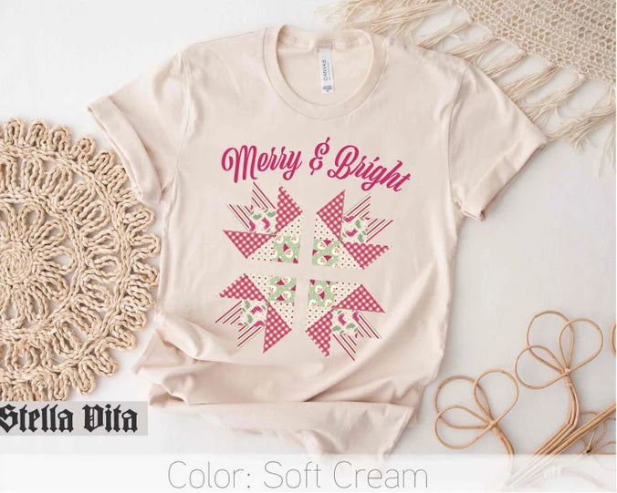 a t - shirt with the words merry and bright on it