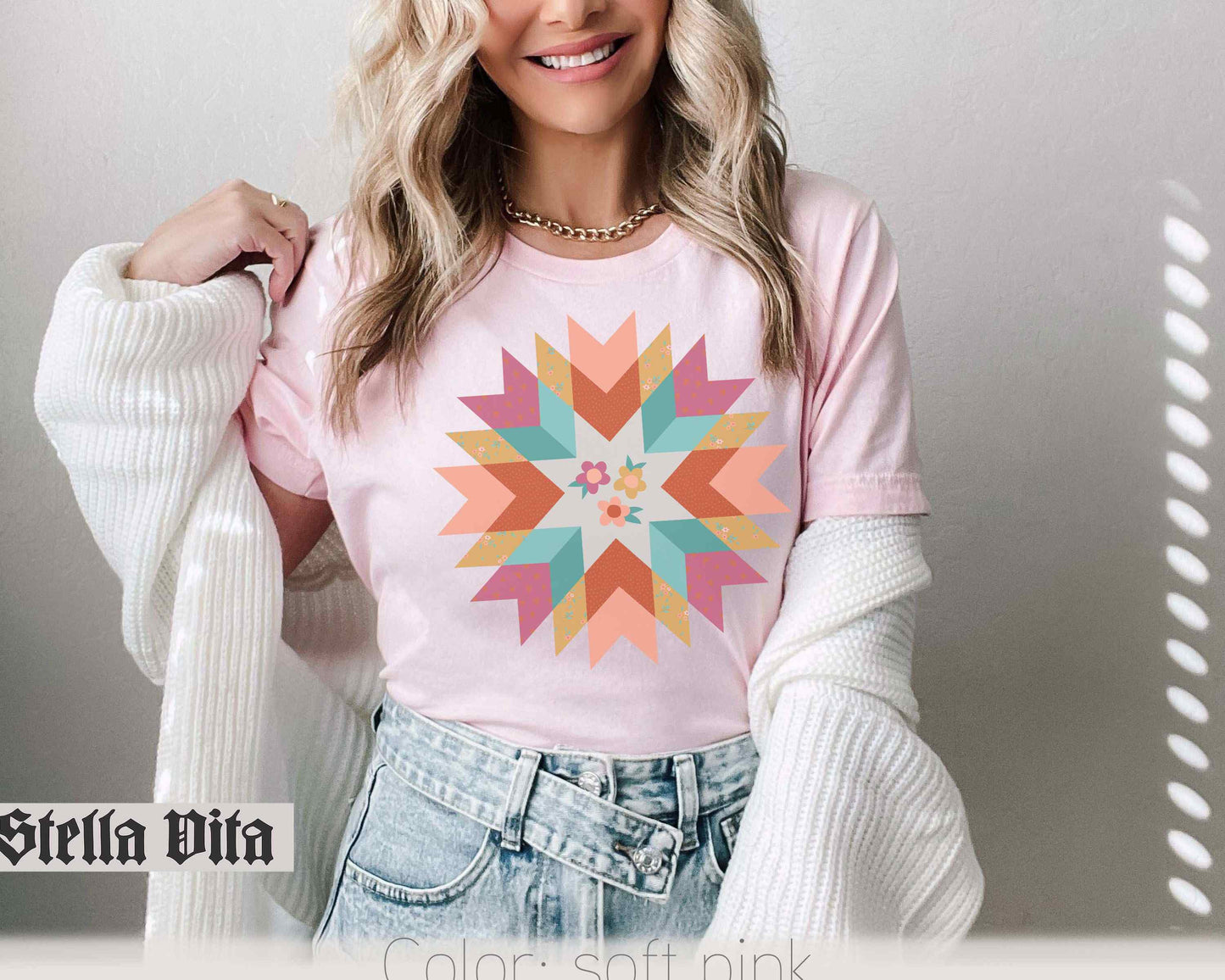 a beautiful blonde woman wearing a pink shirt and jeans