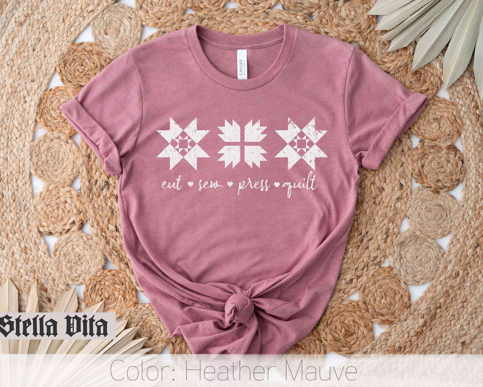 a pink shirt with white stars on it