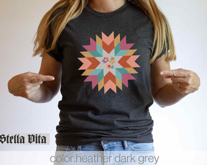 a woman wearing a t - shirt with a star design on it