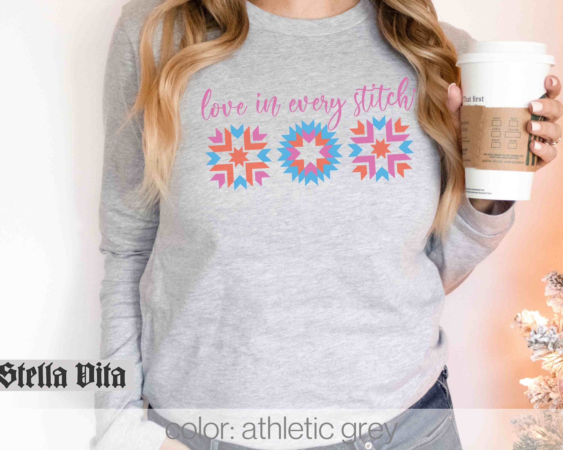 a woman is holding a cup of coffee