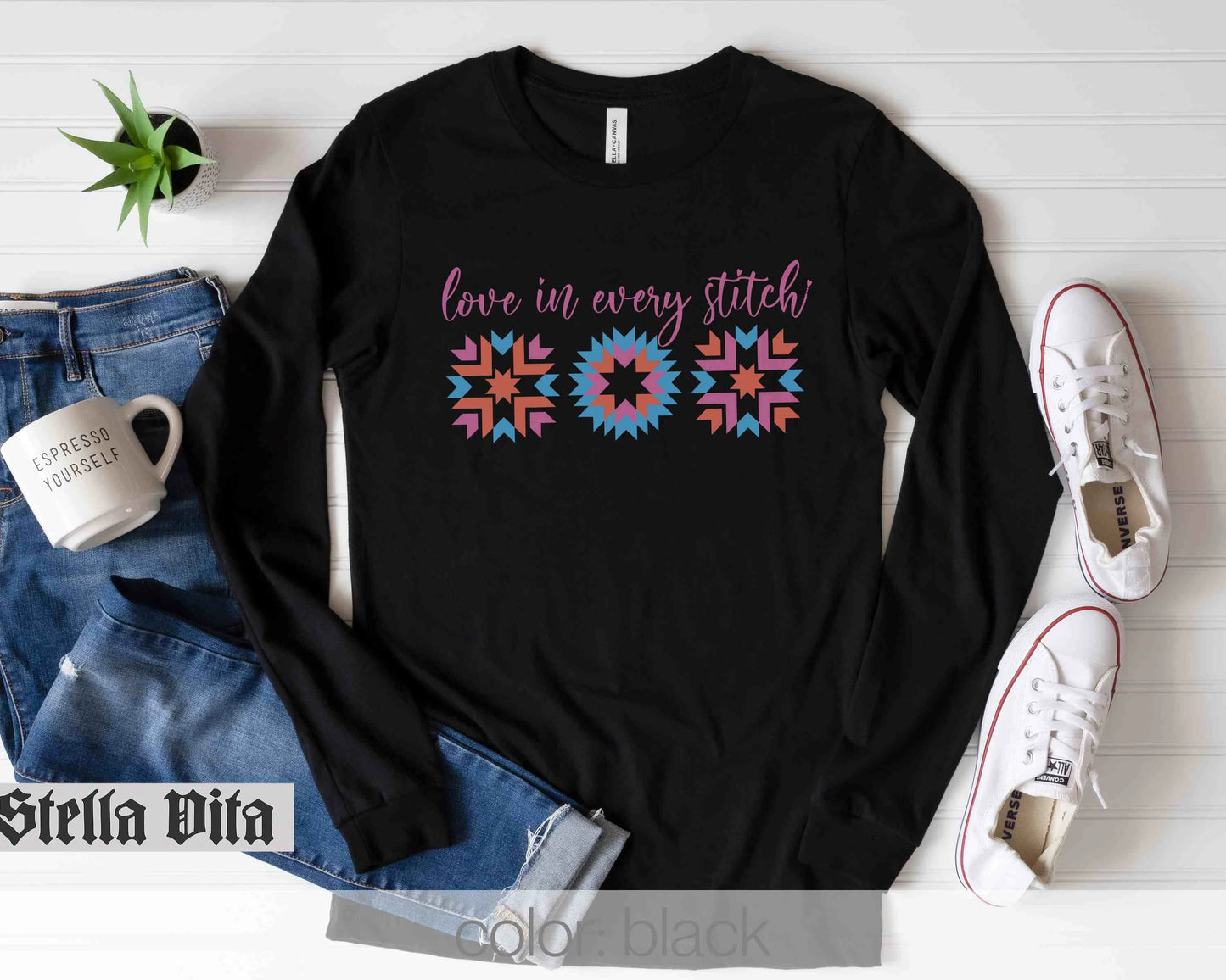 a black shirt that says love is very stitch
