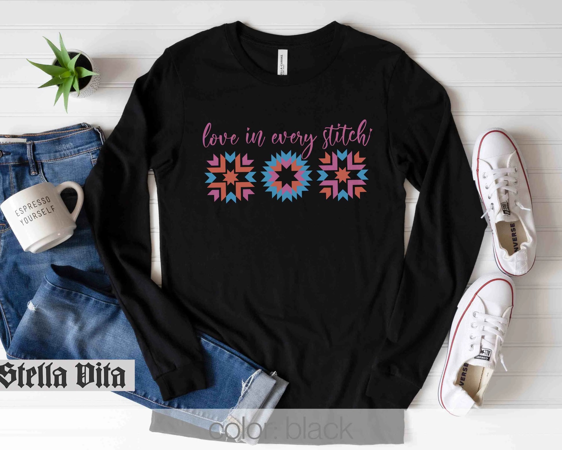 a black shirt that says love is very stitch