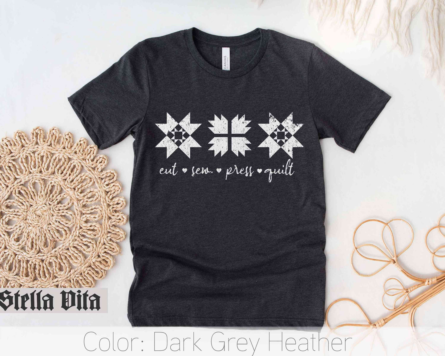 a black t - shirt with white stars on it