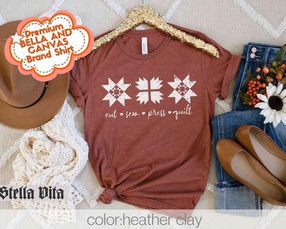 a t - shirt with a cross on it and a cowboy hat next to it