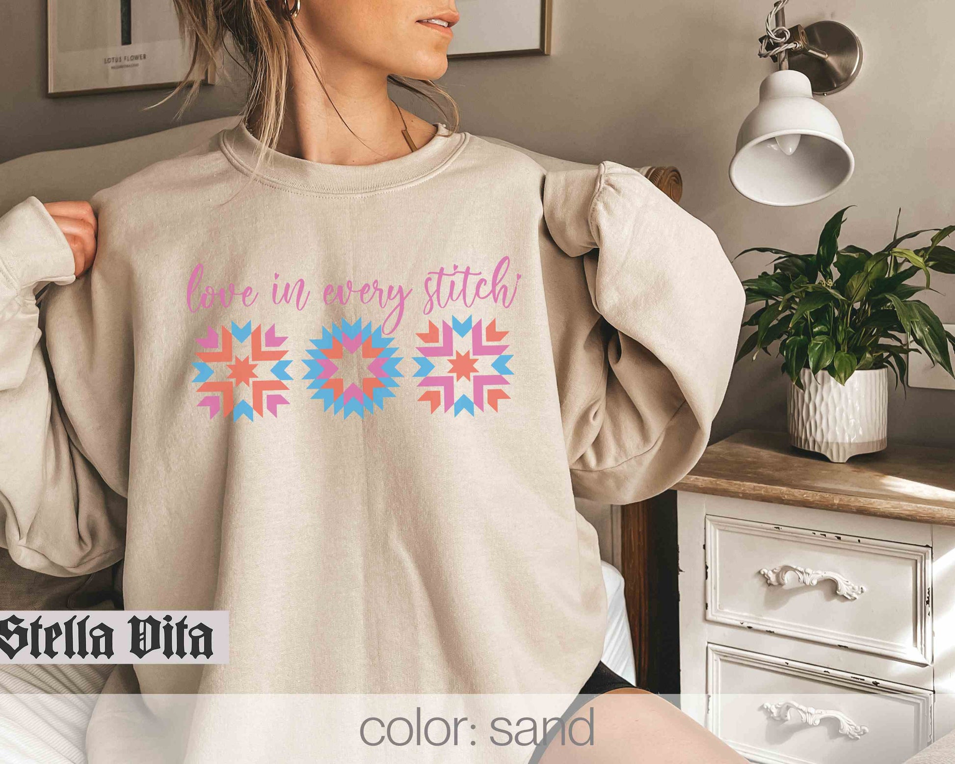 a woman wearing a sweater that says we are very stitched