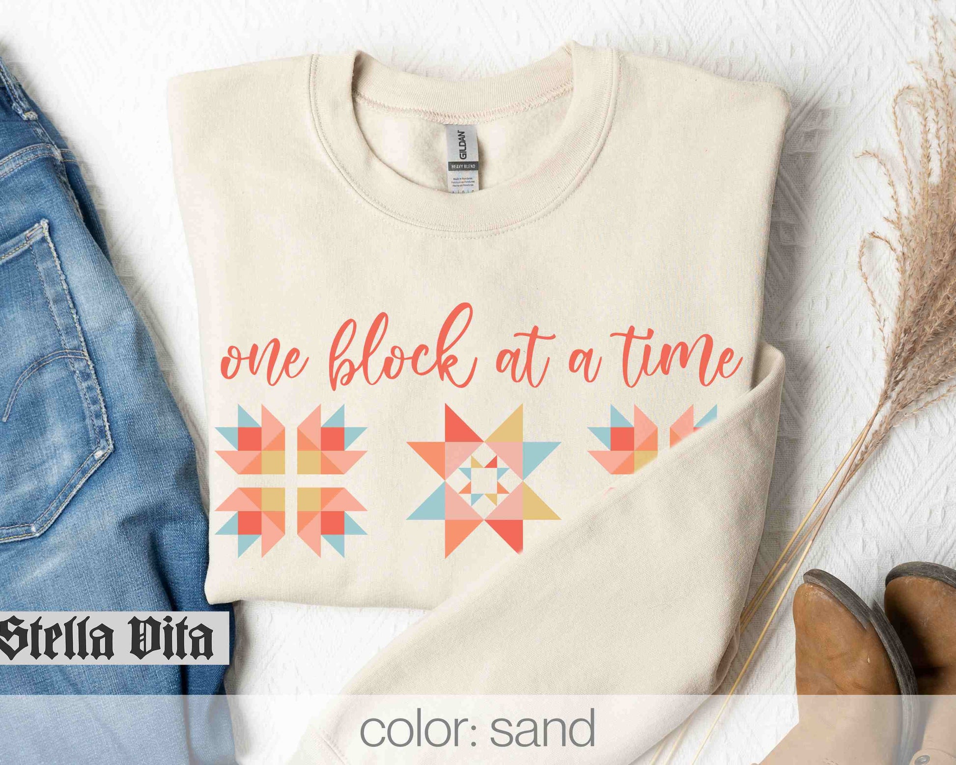 a shirt that says one block at a time and a pair of jeans