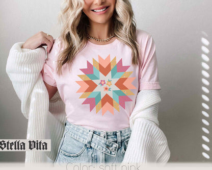 a beautiful blonde woman wearing a pink shirt and jeans