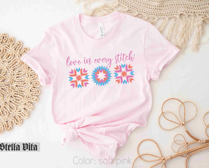 a pink shirt that says love in every stitch