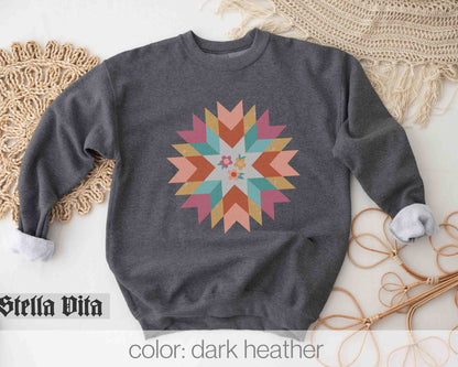 a sweater with a colorful star design on it